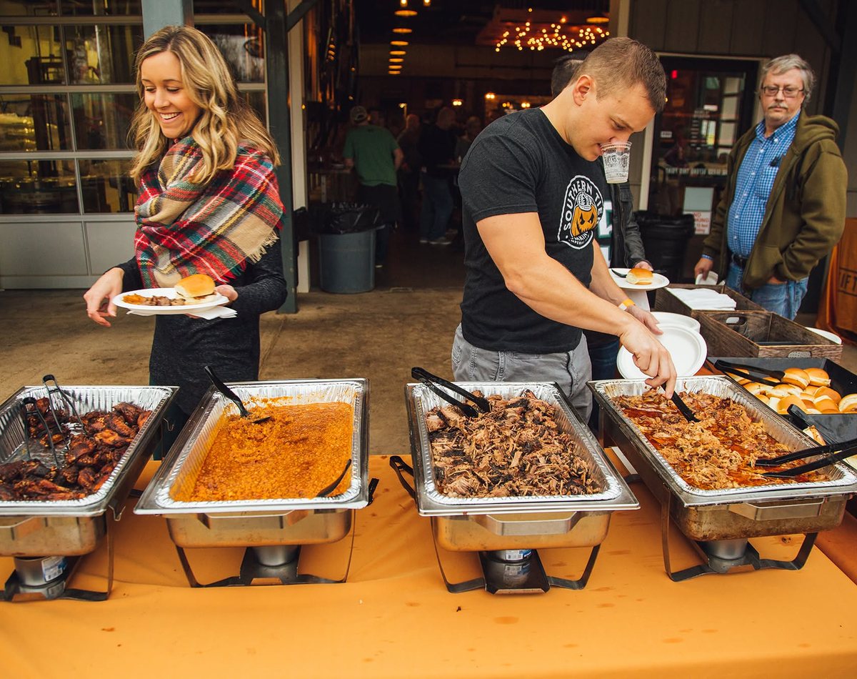 Fifty West catering buffet with BBQ, pulled pork, and sliders