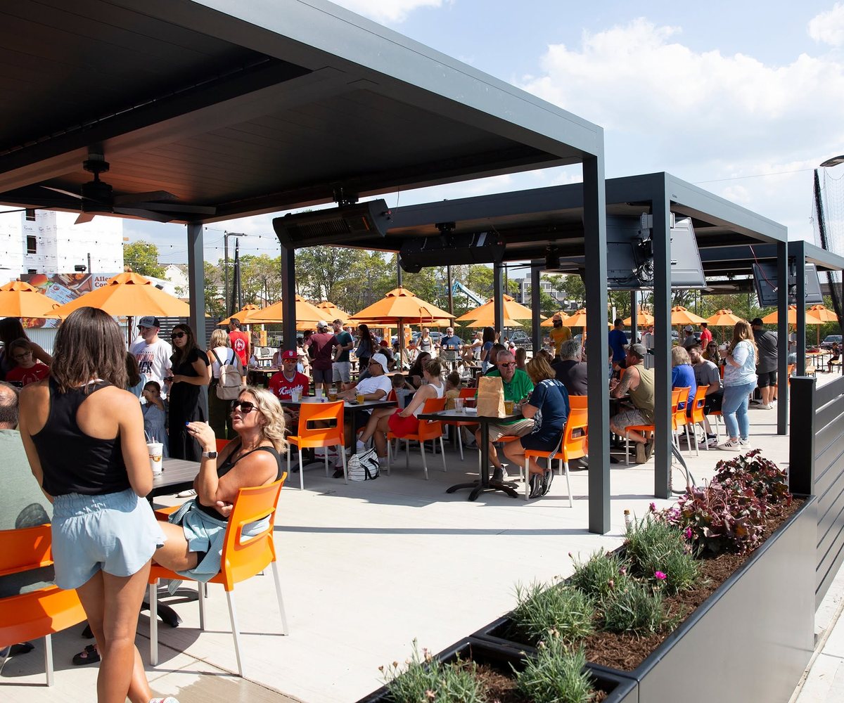 Guests enjoying a reserved party cabana on the Fifty West patio