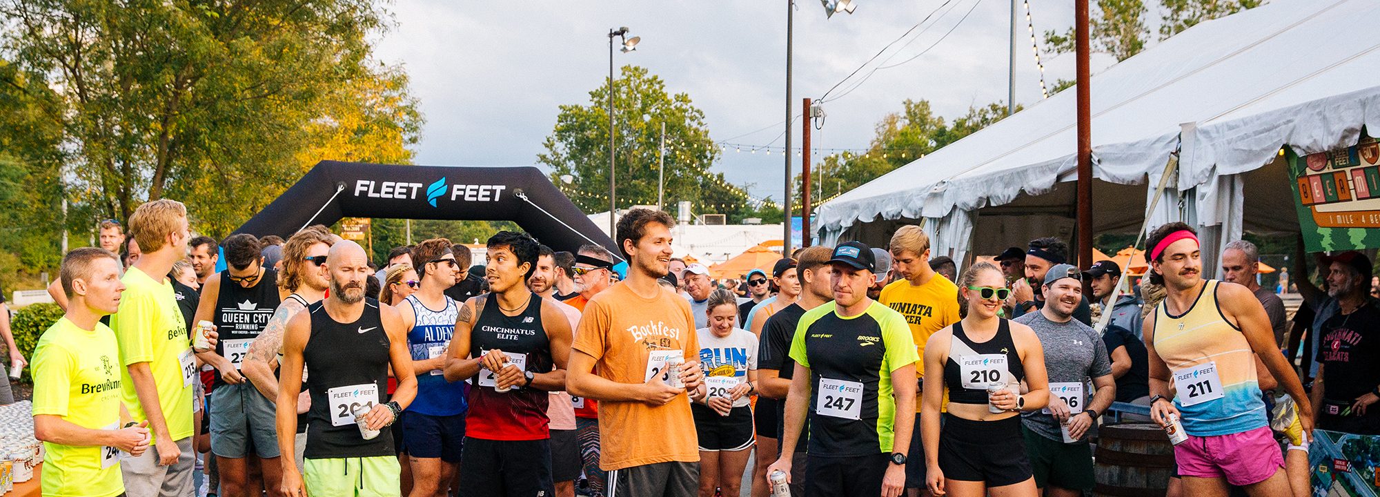 Runners gathered at the start line of a Fifty West beer mile event